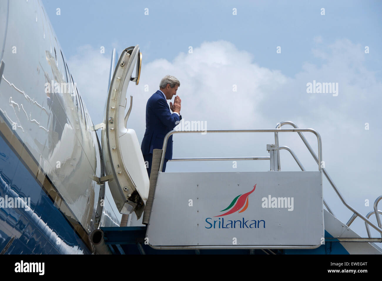 U.S. Secretary of State John Kerry makes the Ayubowan (Sinhalese) /Vanakkam (Tamil) gesture on May 3, 2015, in Colombo, Sri Lanka, as he prepares to board his airplane and depart the island-nation after the first official visit by someone in his office in 43 years. Stock Photo