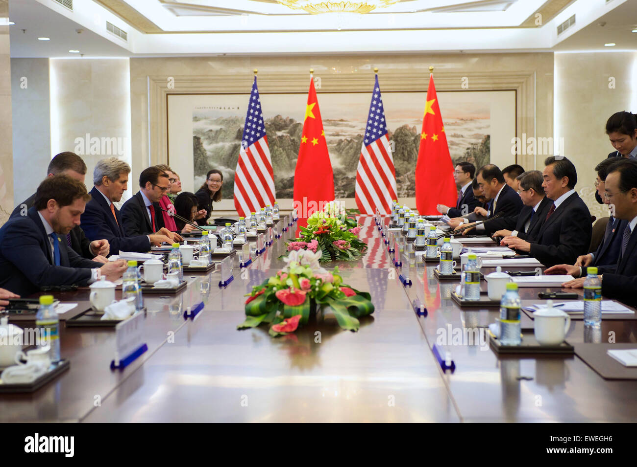 U.S. Secretary of State John Kerry sits across from Chinese Foreign Minister Wang Yi at the Ministry of Foreign Affairs in Beijing, China, during a bilateral meeting on May 16, 2015. Stock Photo