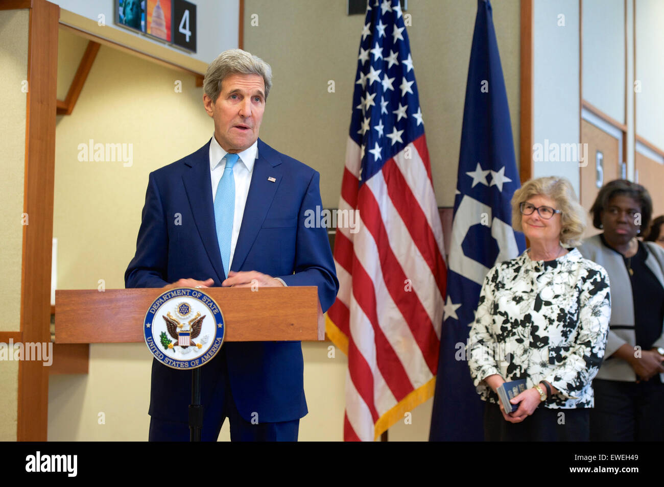 U.S. Secretary of State John Kerry, watched by Acting Assistant Secretary of State for Consular Affairs Michele Bond, chats with a Yemeni-American who received travel documents for family members who had to flee from Yemen during an event at the U.S. Embassy in Djibouti, Djibouti, on May 6, 2015, after the Secretary visited a local mosque, met with President Ismail Omar Guelleh and the Foreign Minister, and before a visit with U.S. forces at Camp Lemonnier. Stock Photo