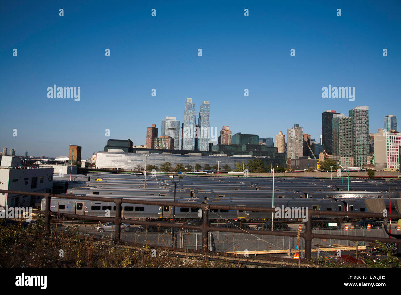 Stationary commuter trains waiting in The West Side Yard  of The Empire Connection from The High Line New York City USA Stock Photo