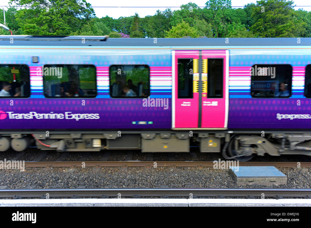 First Transpennine Express train at speed. Oxenholme Rail Station, Cumbria, England, United Kingdom, Europe. Stock Photo