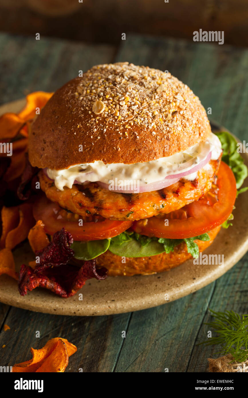 Homemade Organic Salmon Burger with Tartar Sauce Stock Photo