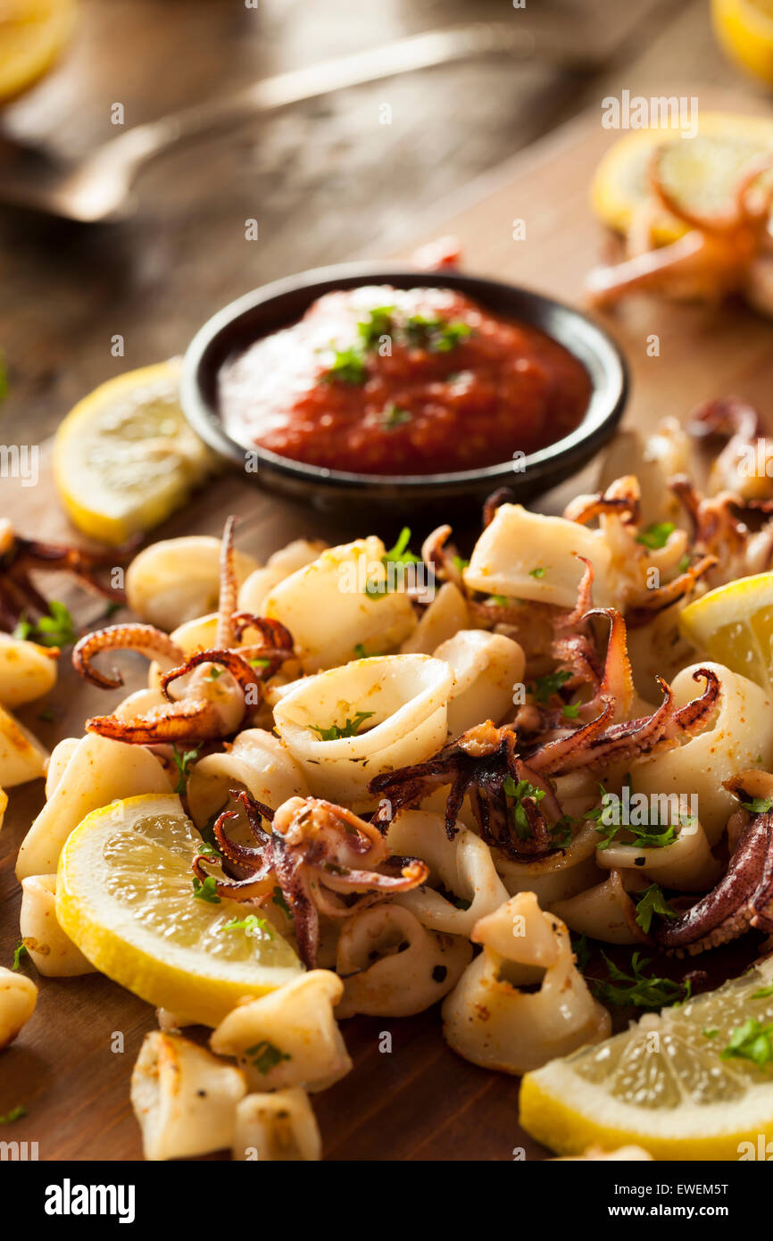 Homemade Fresh Grilled Calamari with Lemon and Sauce Stock Photo