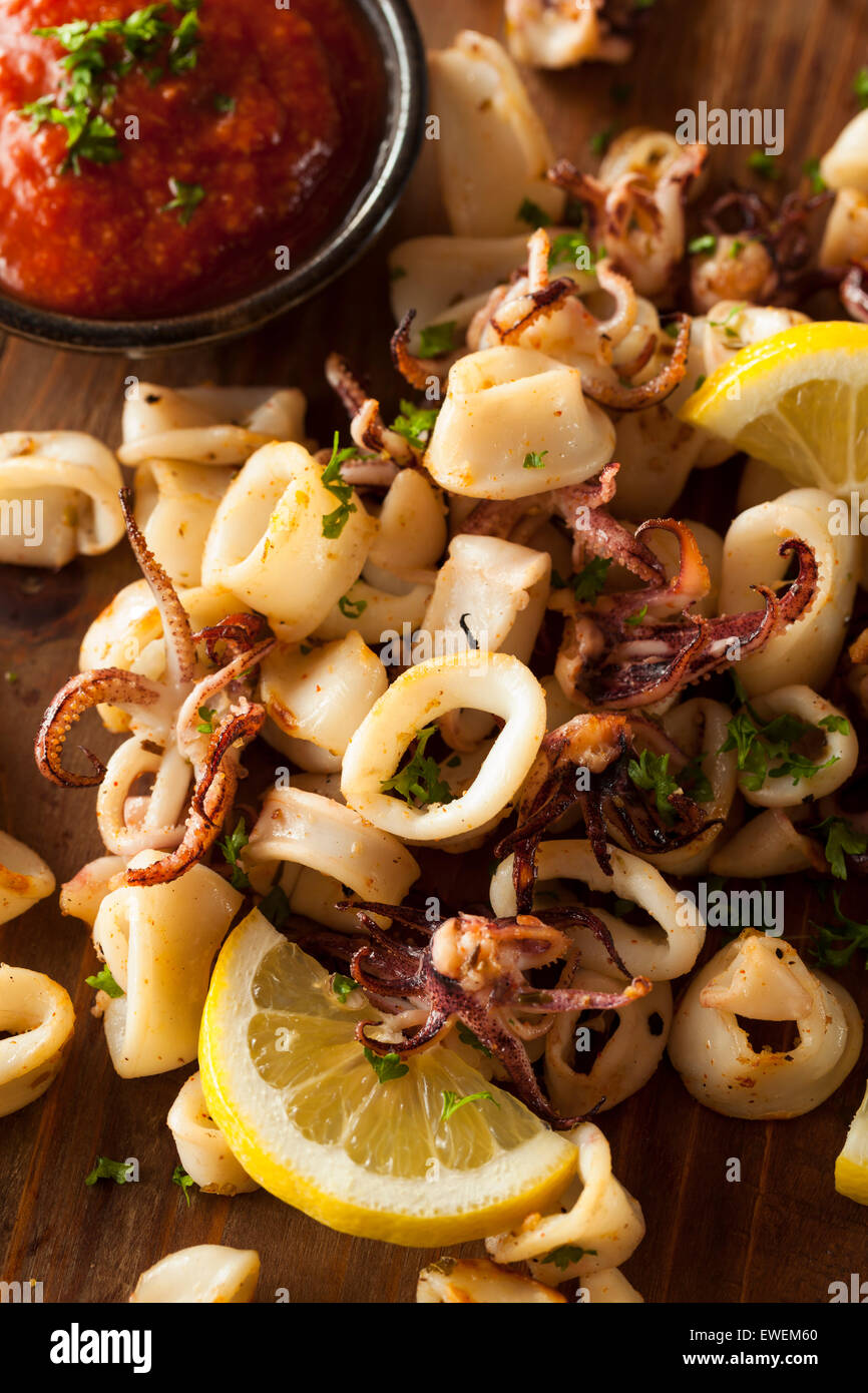 Homemade Fresh Grilled Calamari with Lemon and Sauce Stock Photo