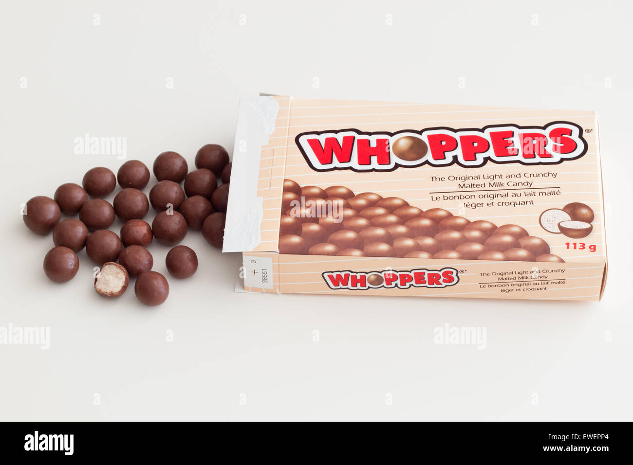 A box of Whoppers candy.  Whoppers are malted milk balls covered with chocolate and produced by the Hershey Company. Stock Photo