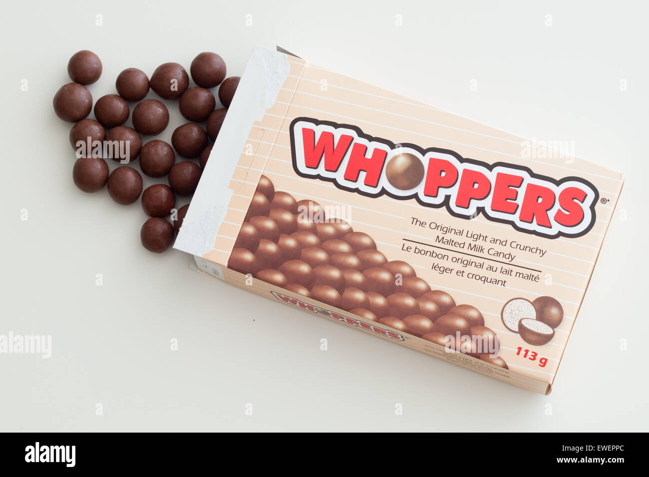 A box of Whoppers candy.  Whoppers are malted milk balls covered with chocolate and produced by the Hershey Company. Stock Photo