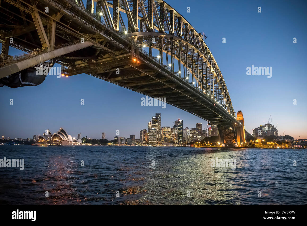 night shot of Sydney harbour with the opera house, harbour bridge and the city Stock Photo