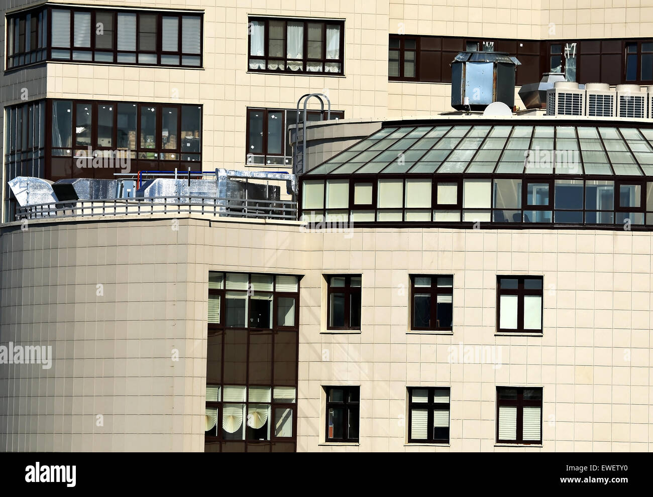 Ventilation pipes and actuators on the roof of an modern building Stock Photo