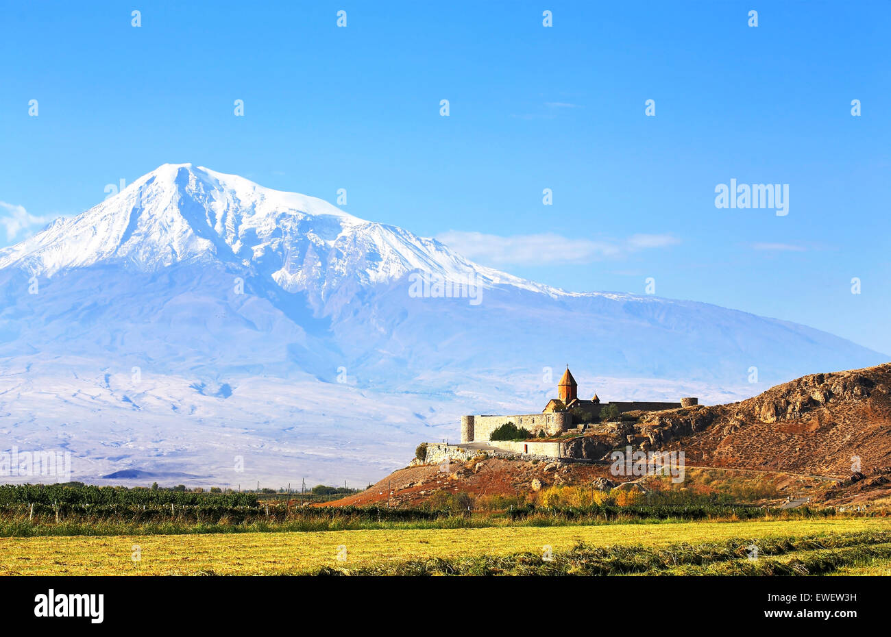 Ancient monastery on a background of mountains and grape fields Stock Photo