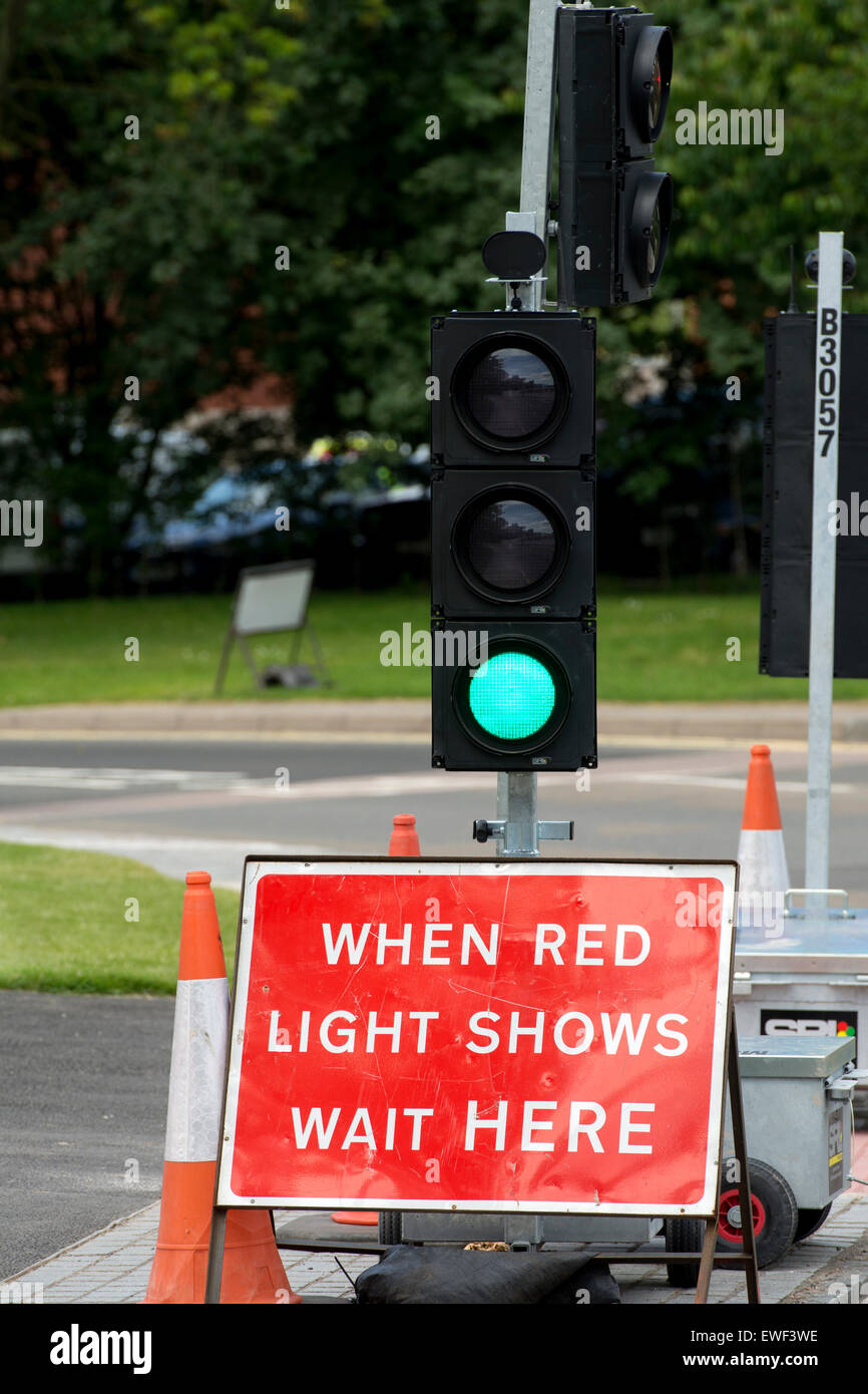 Temporary traffic lights on green, Warwick University campus, UK Stock Photo