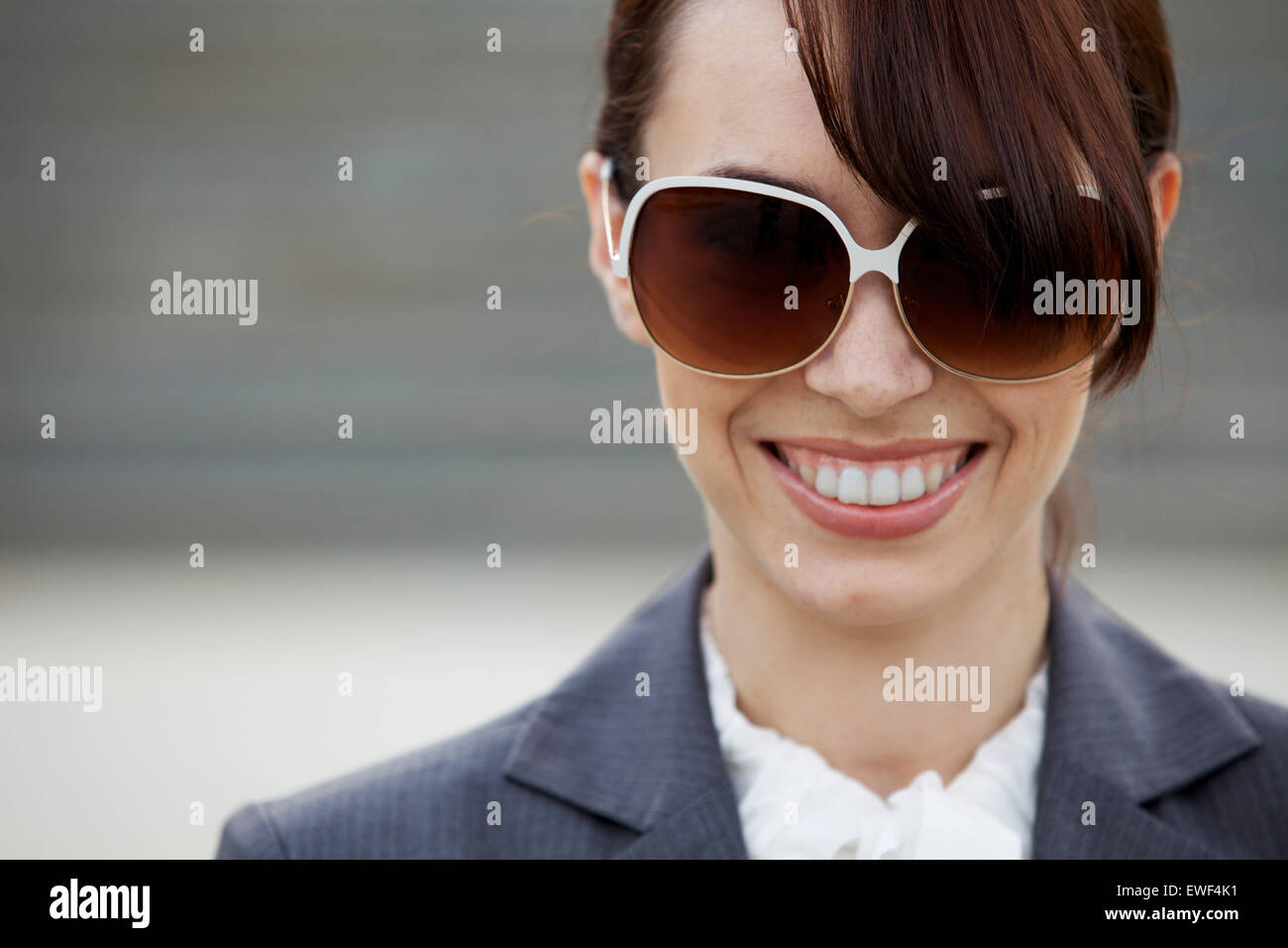 Close-up of a young woman wearing sunglasses Stock Photo - Alamy