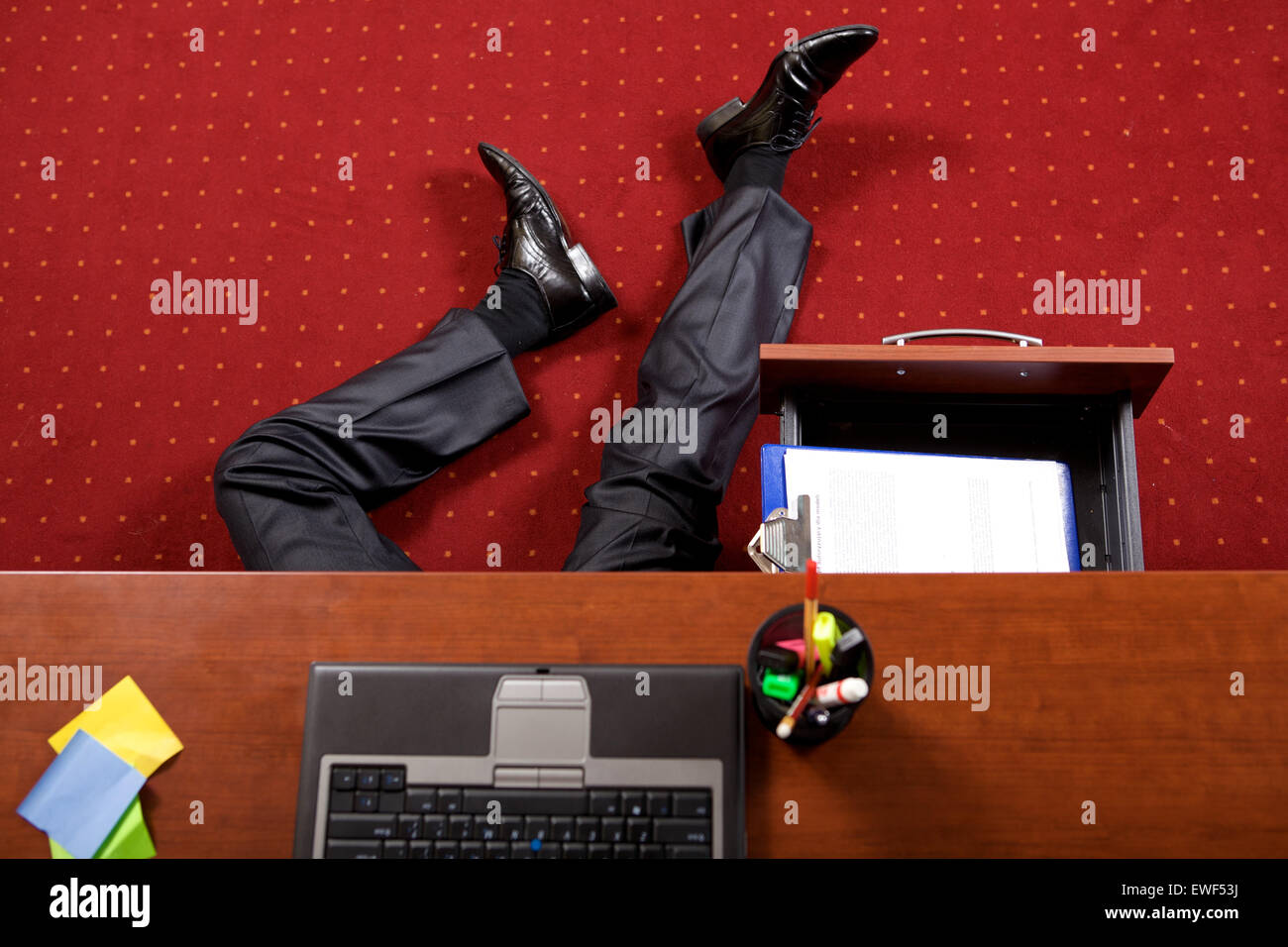 Businessman lying in the office Stock Photo