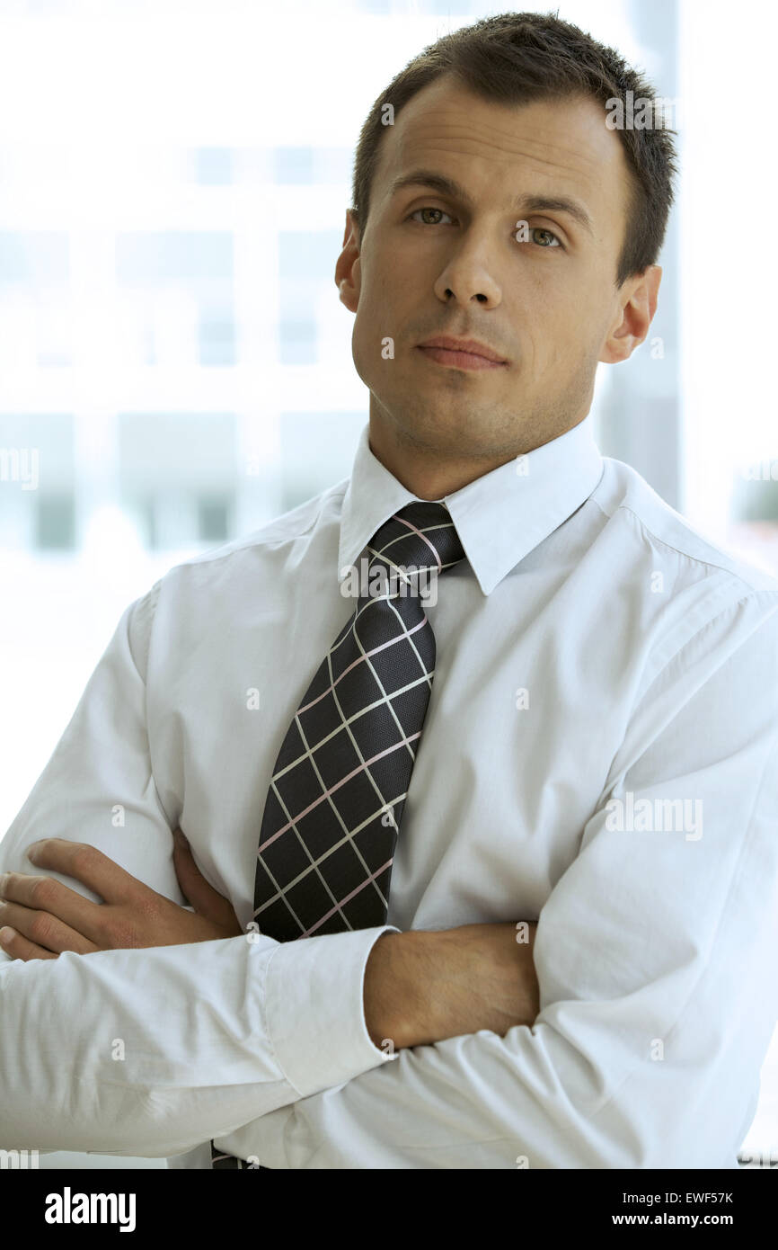 Portrait of businessman with arms crossed Stock Photo - Alamy