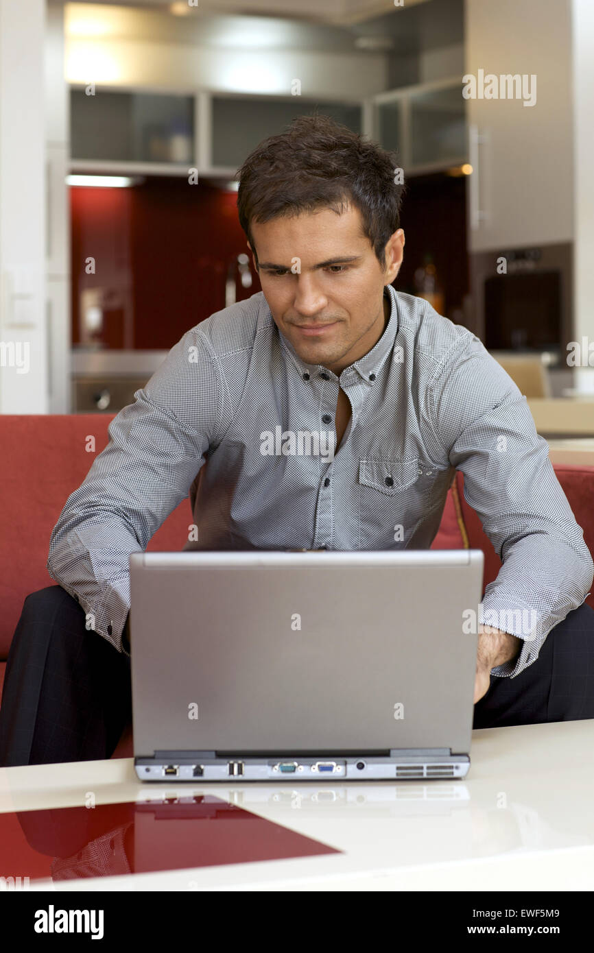 Young man laptop hi-res stock photography and images - Alamy