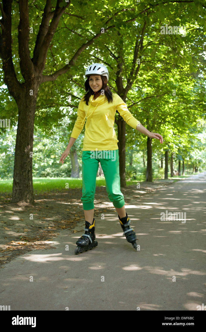 Yong woman riding roller skate Stock Photo