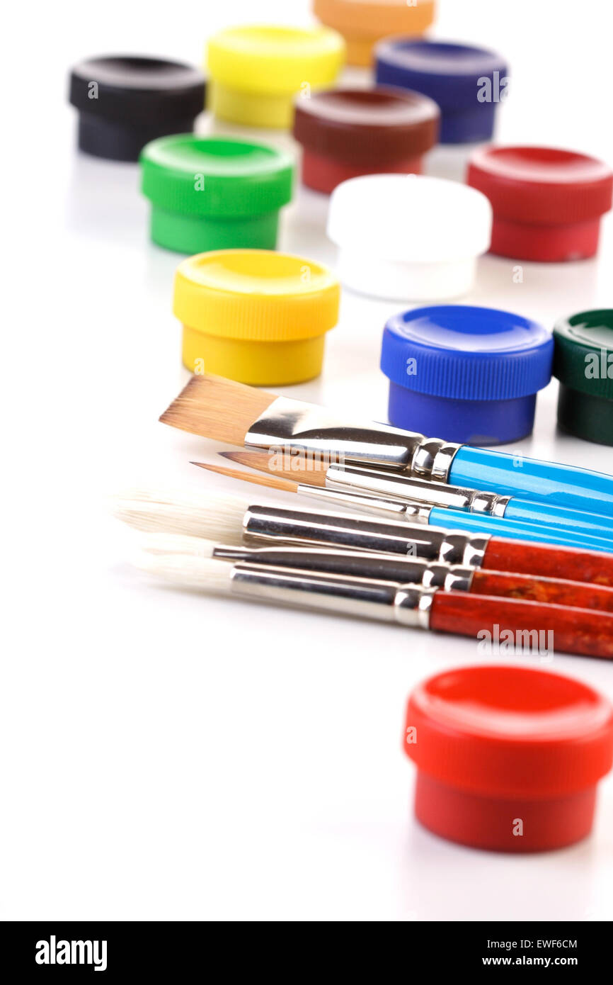 Paint boxes and brushes on white background Stock Photo Alamy