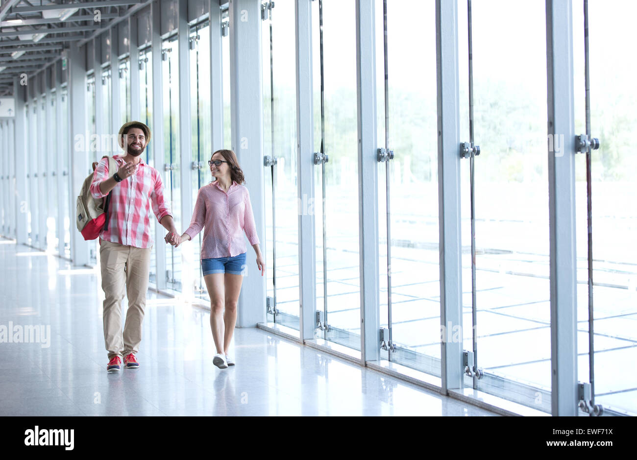 Couple holding hands walking hi-res stock photography and images - Alamy
