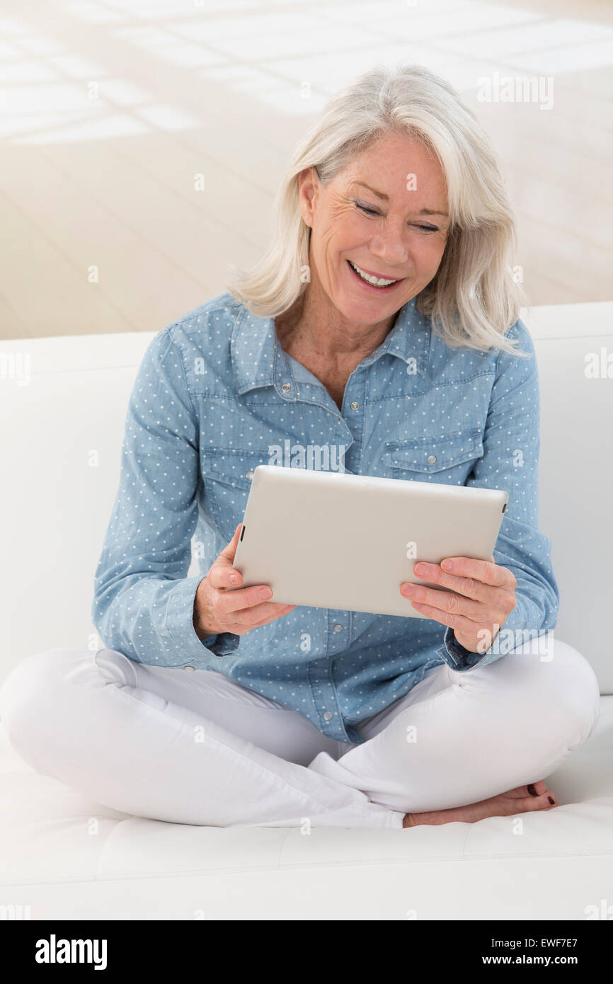 SENIOR WITH TABLET Stock Photo