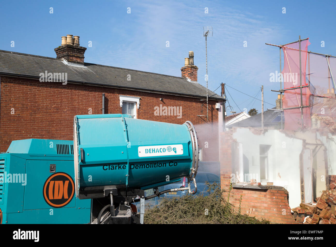 Dehaco water cannon sprayer dampening dust at a demolition site, Woodbridge, Suffolk, England, UK Stock Photo