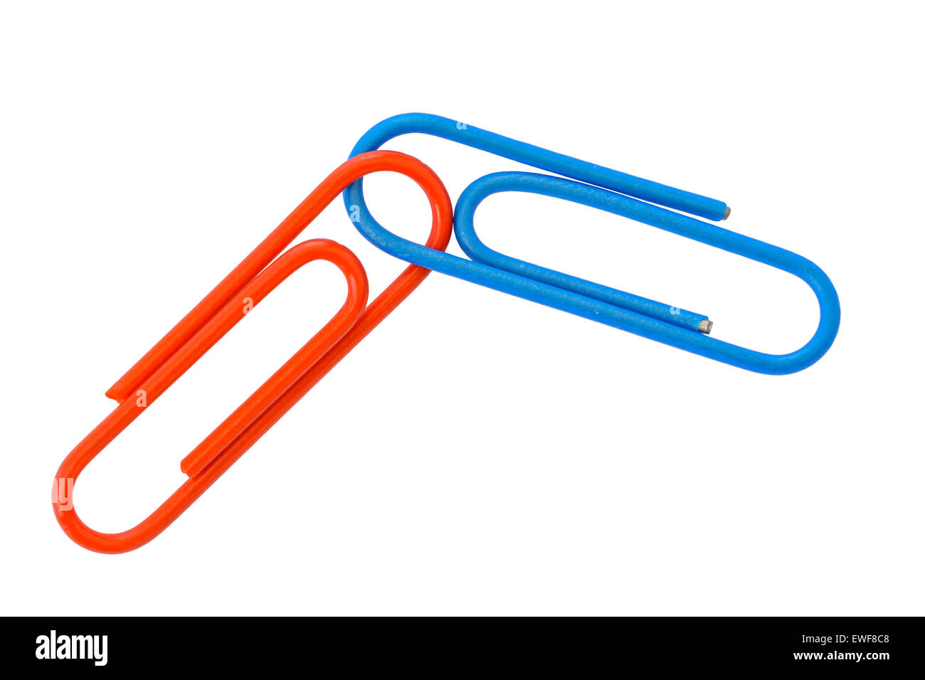 Link concept. Red and blue paperclips linked on a white background. Stock Photo