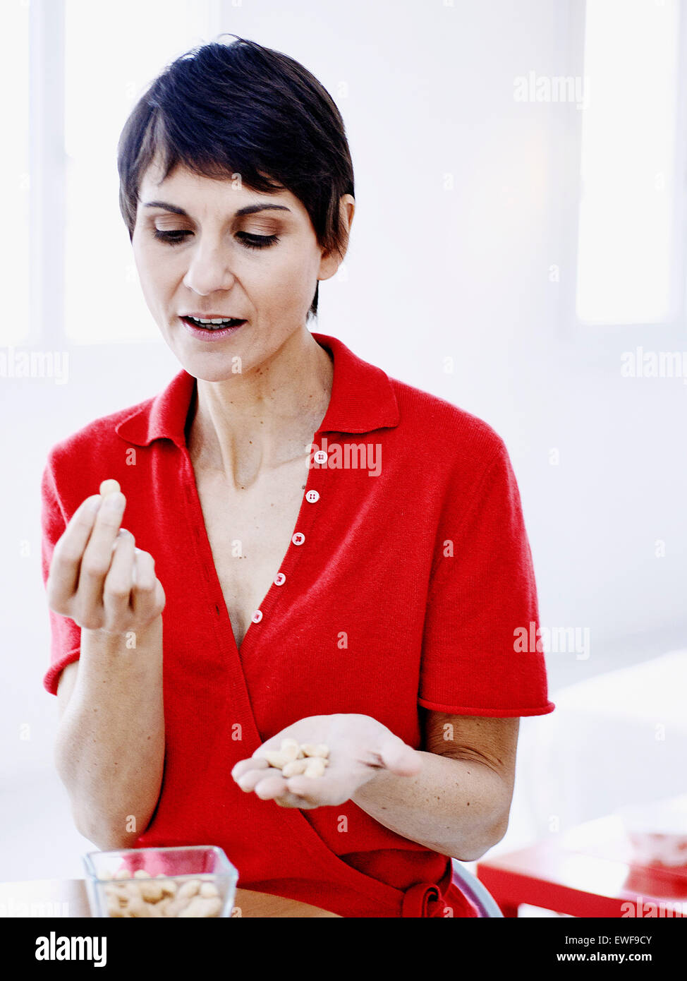 WOMAN EATING DRIED FRUIT Stock Photo Alamy