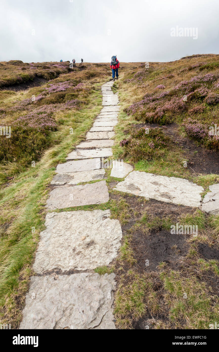 Paved path using stone flags on Kinder Scout helping to control moorland erosion, Derbyshire, Peak District National Park, England, UK Stock Photo