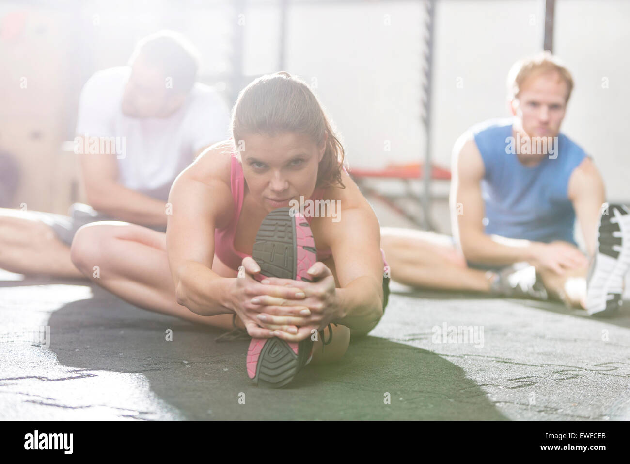 Portrait of confident woman exercising in crossfit gym Stock Photo