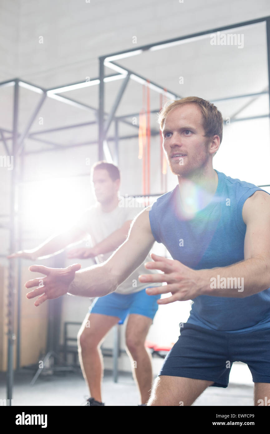 Determined men exercising at crossfit gym Stock Photo - Alamy
