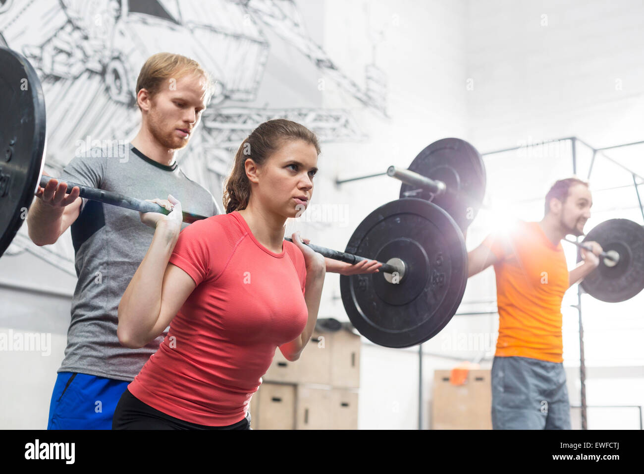 People lifting barbells in crossfit gym Stock Photo Alamy