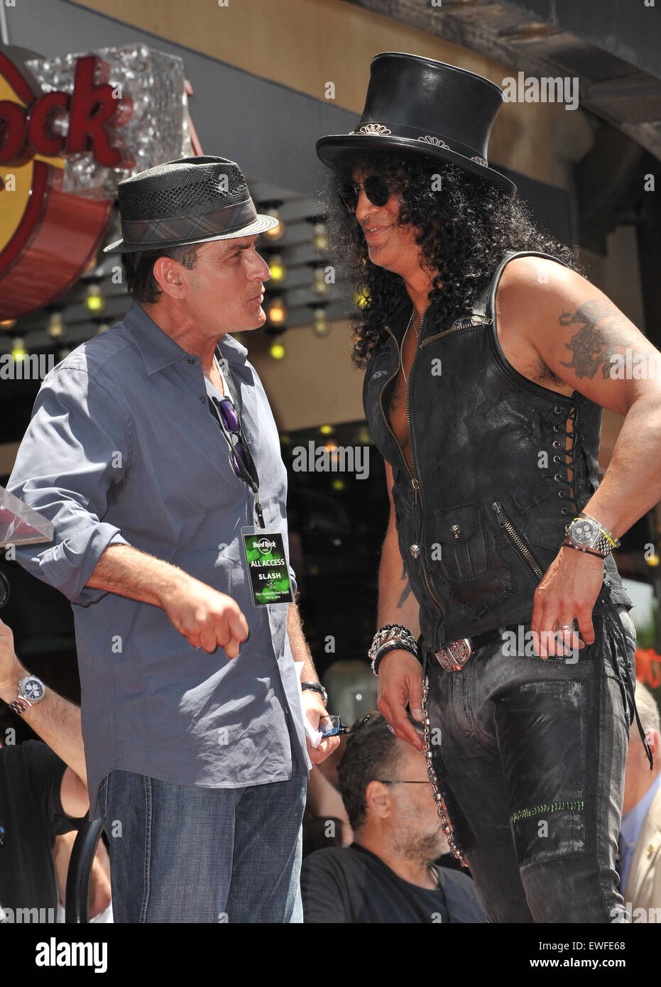 LOS ANGELES, CA - JULY 10, 2012: Rock guitarist Slash & actor Charlie Sheen on Hollywood Blvd where he was honored with a star on the Hollywood Walk of Fame. Stock Photo