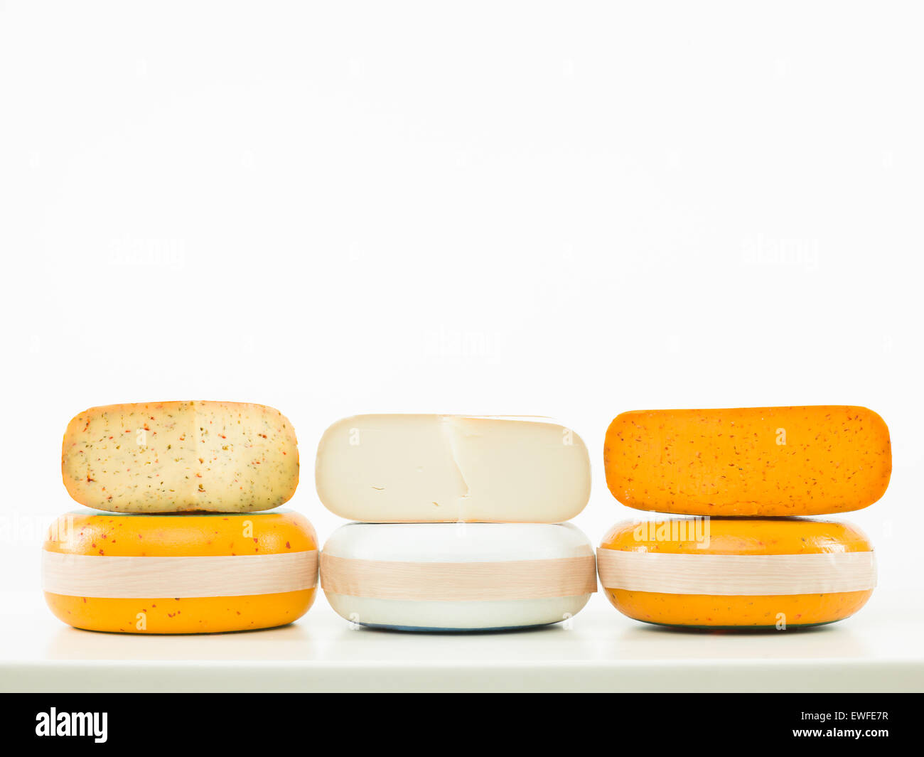 three kinds of cheese arranged in line on white background Stock Photo