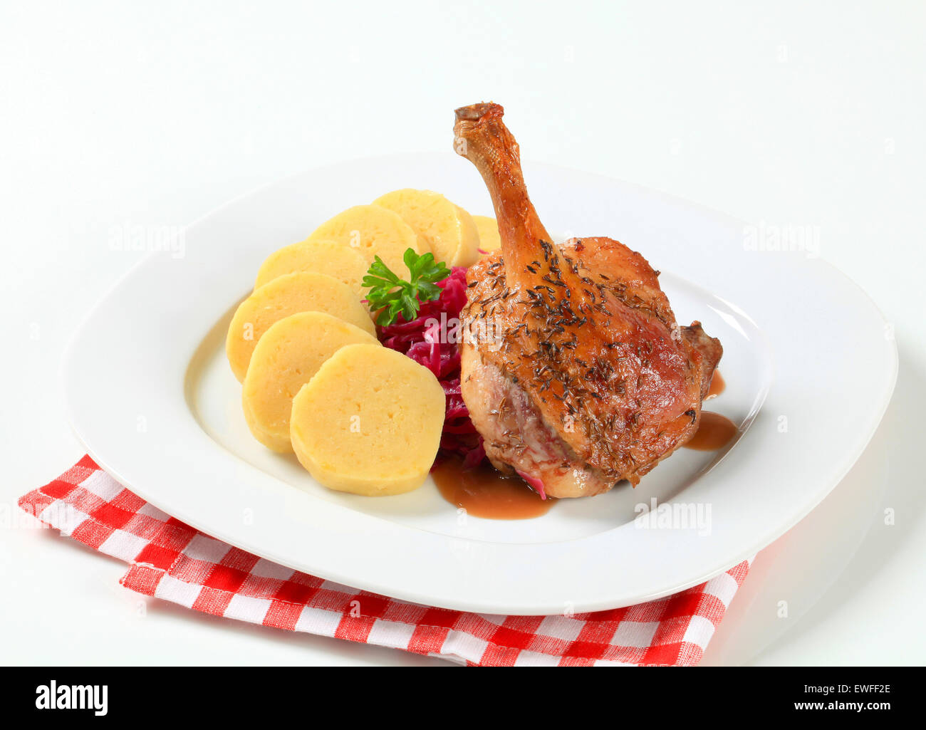 Dish of roast duck leg with potato dumplings and red cabbage Stock Photo