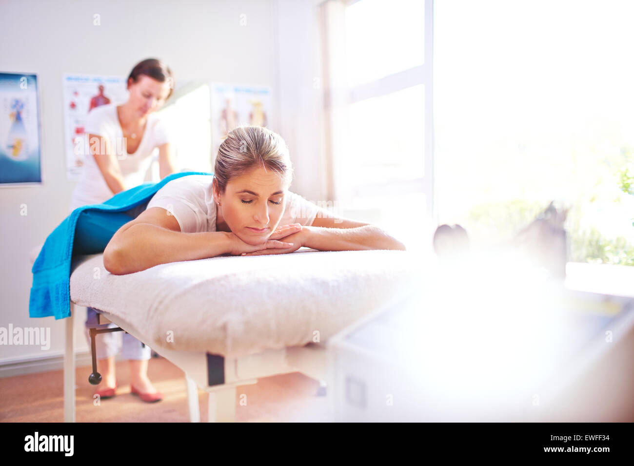 Woman receiving massage by physical therapist Stock Photo