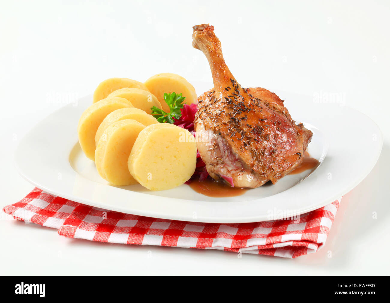 Dish of roast duck leg with potato dumplings and red cabbage Stock Photo