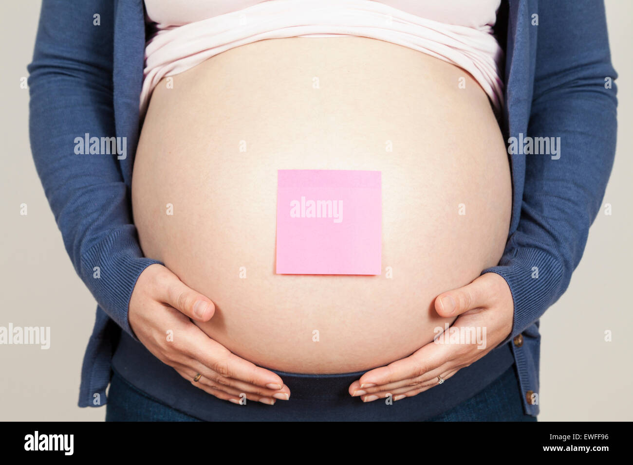 Pregnant woman with adhesive label Stock Photo Alamy