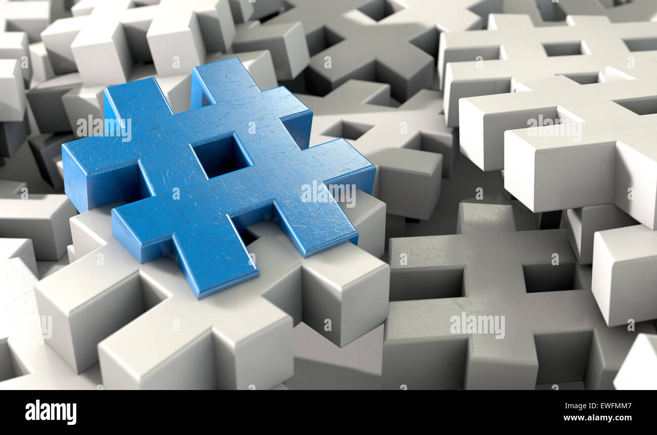 A concept image showing a scattered collection of white hashtags and a single blue one on an isolated studio background Stock Photo