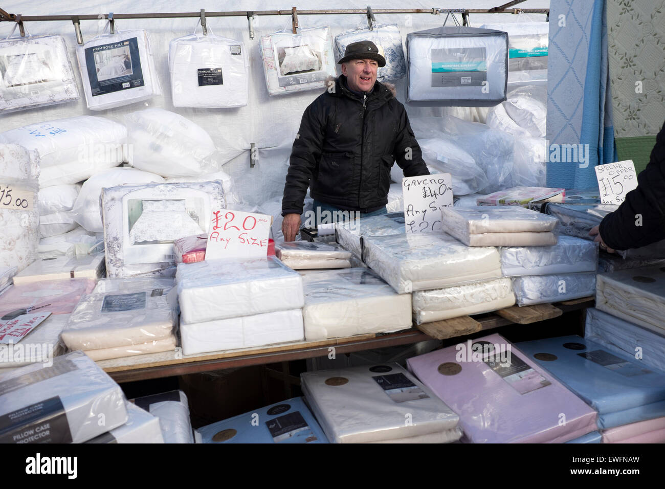 Market Trader Stall Holder Selling Bedding Linen Stock Photo
