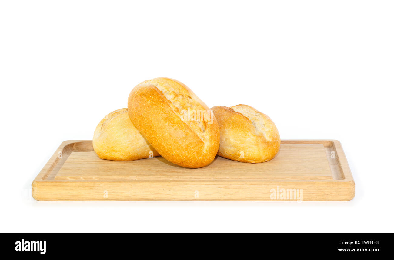 Fresh German bread rolls on a wooden breakfast tray against white background Stock Photo
