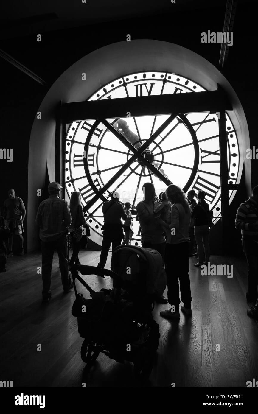 Paris, France - August 10, 2014: Interior with famous ancient clock window in Orsay Museum, tourists and visitors are taking pho Stock Photo