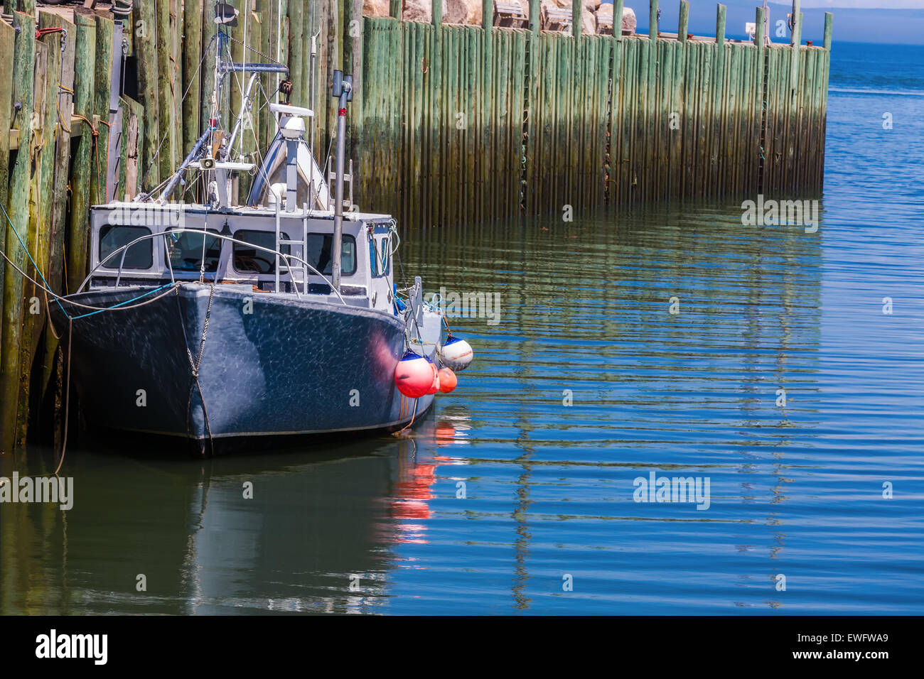 A lobster fishing boat tied up at the wharf in Hall's Harbour, Nova