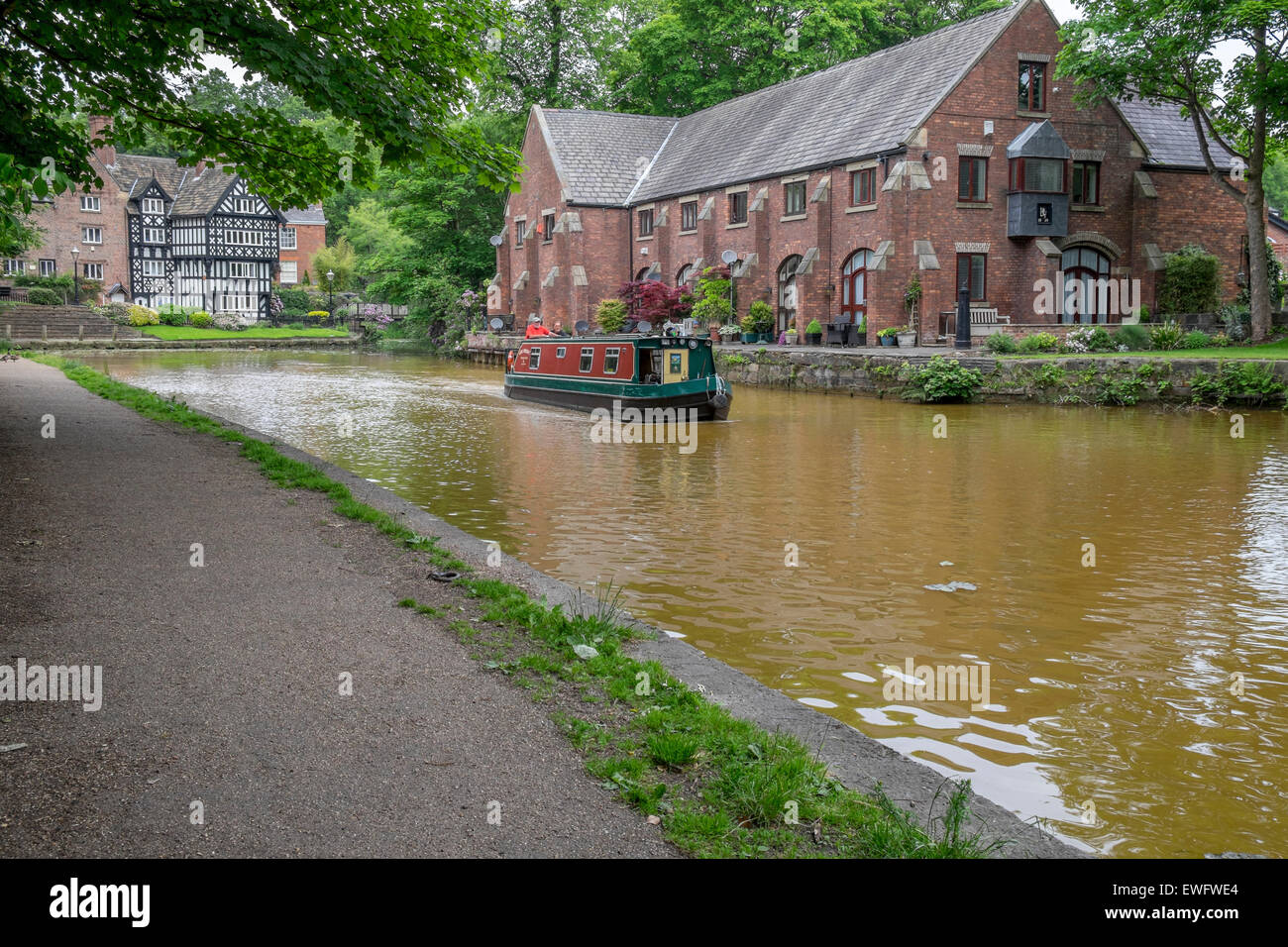 Bridgewater Canal with tow path and canal boats in centre of the canal Stock Photo