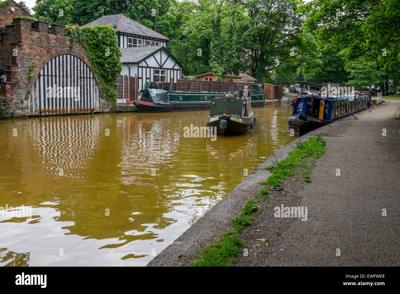 Bridgewater Canal with tow path and canal boats moored up Stock Photo
