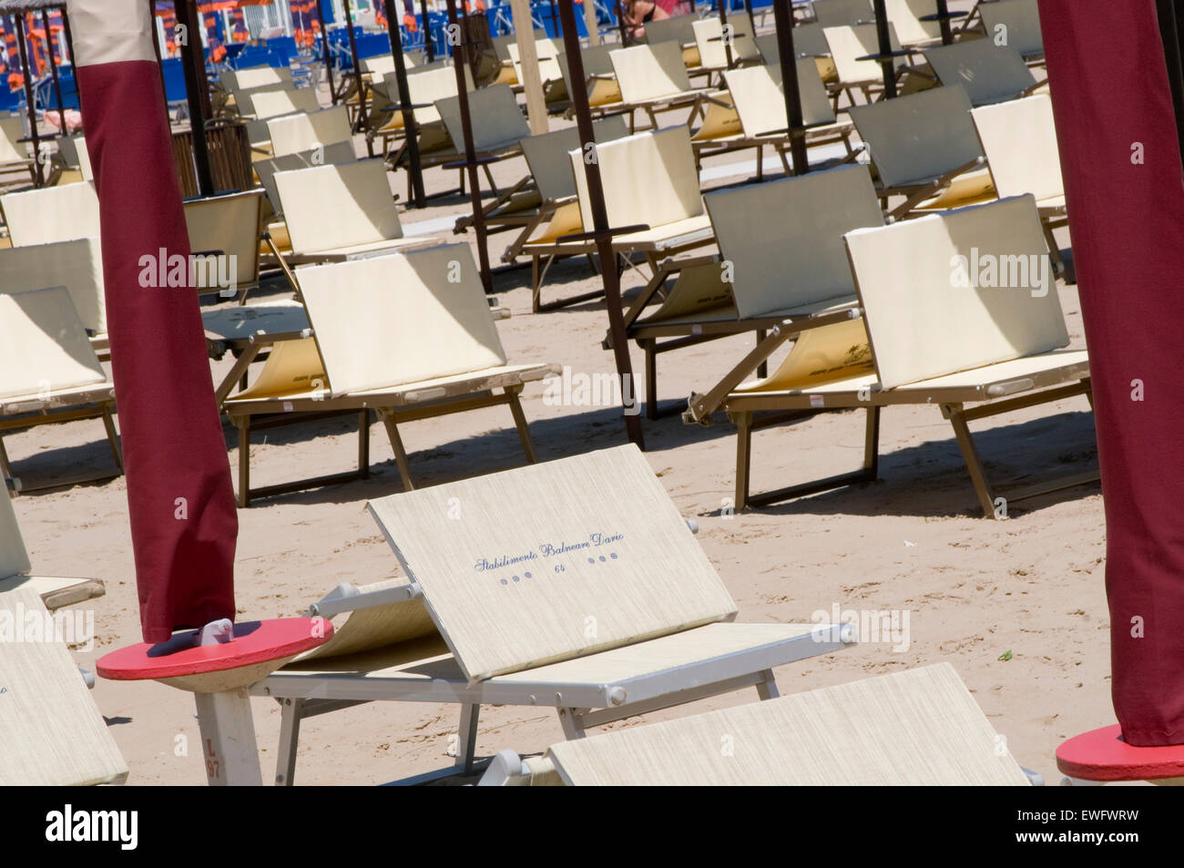 sunloungers sunlounger lounger loungers sun italy italian beach beaches Stock Photo