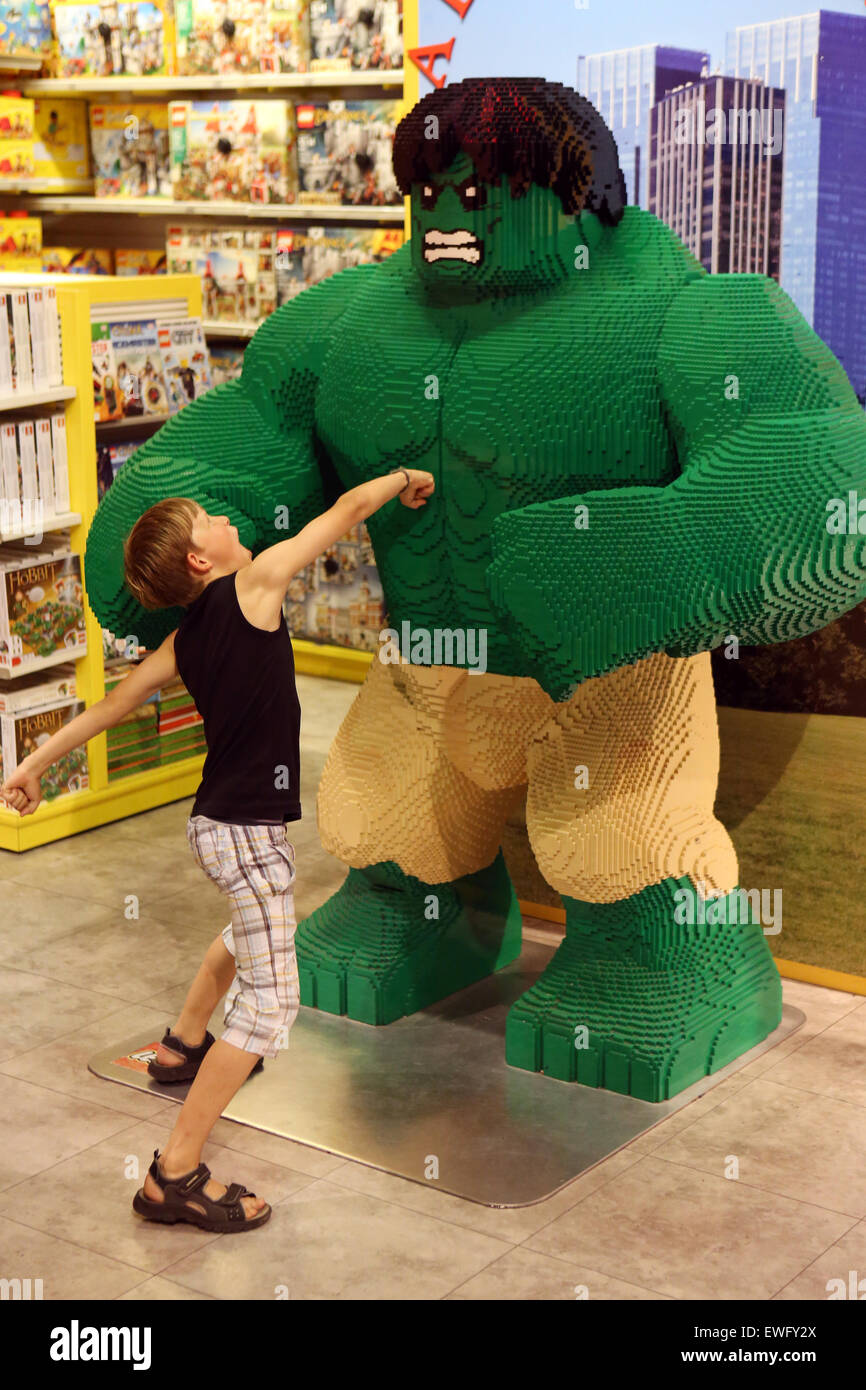New York, USA, boy playing with the built of Lego bricks cartoon character Hulk Stock Photo