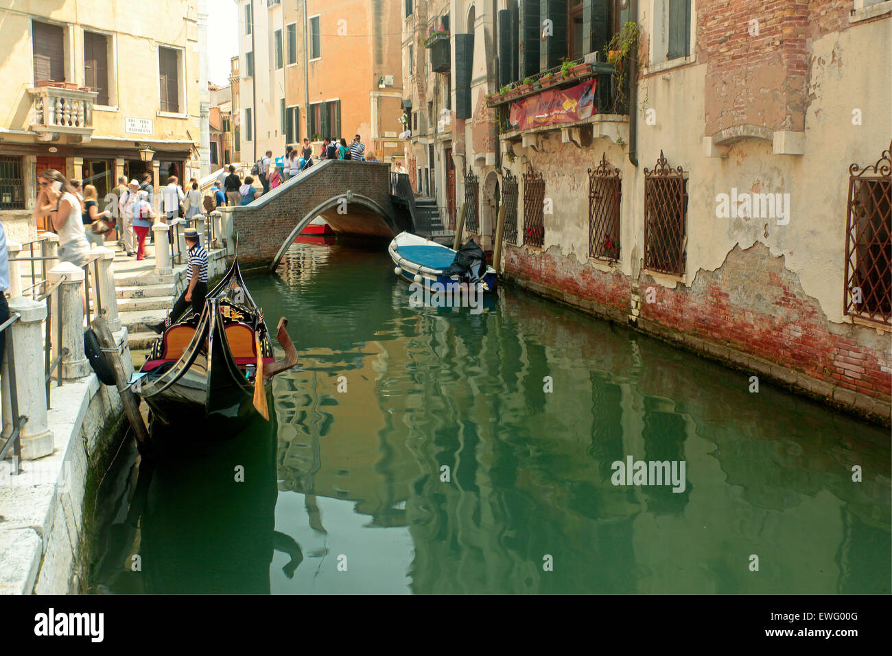 Venice-  Terà de la Maddalena- Rio Terà de la Maddalena -Gondola boat and gondolier Stock Photo