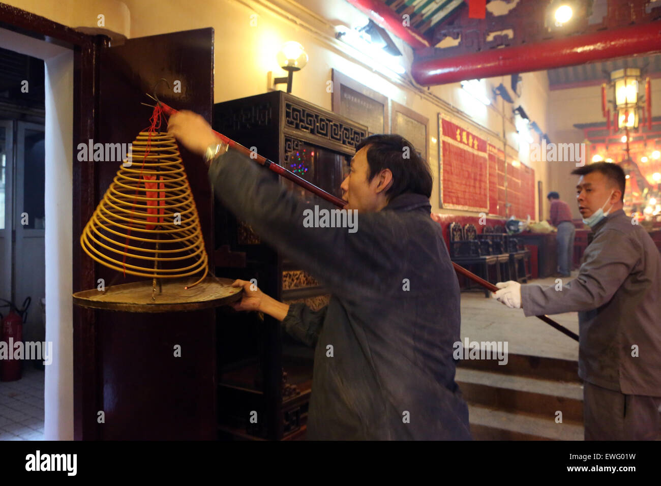 Hong Kong, China, Buddhist devotees Hanging Man Mo Temple incense a spiral on Stock Photo