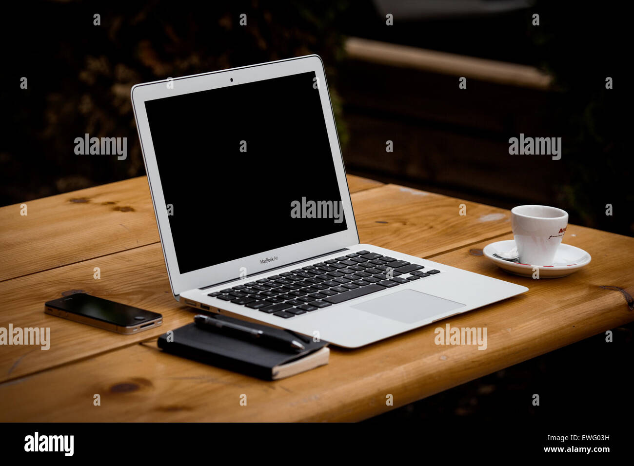 Apple Macbook Air on Wood Tabletop with Espresso Cup, Notepad, Stock Photo