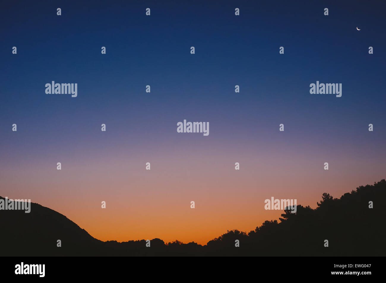 Sky Before Sunrise with Moon Stock Photo