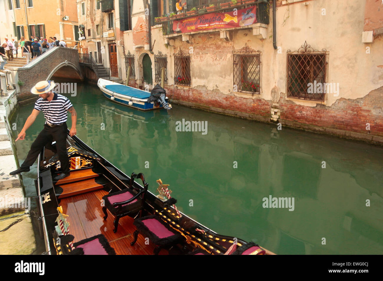 Venice-  Rio Terà de la Maddalena -Gondola boat and gondolier Stock Photo