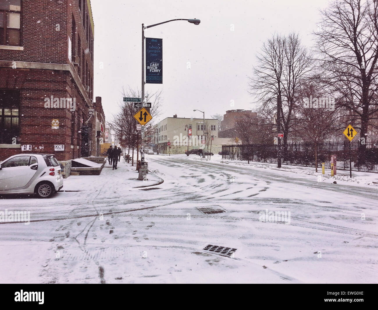 This image depicts an icy intersection on Guernsey Street, showing ...